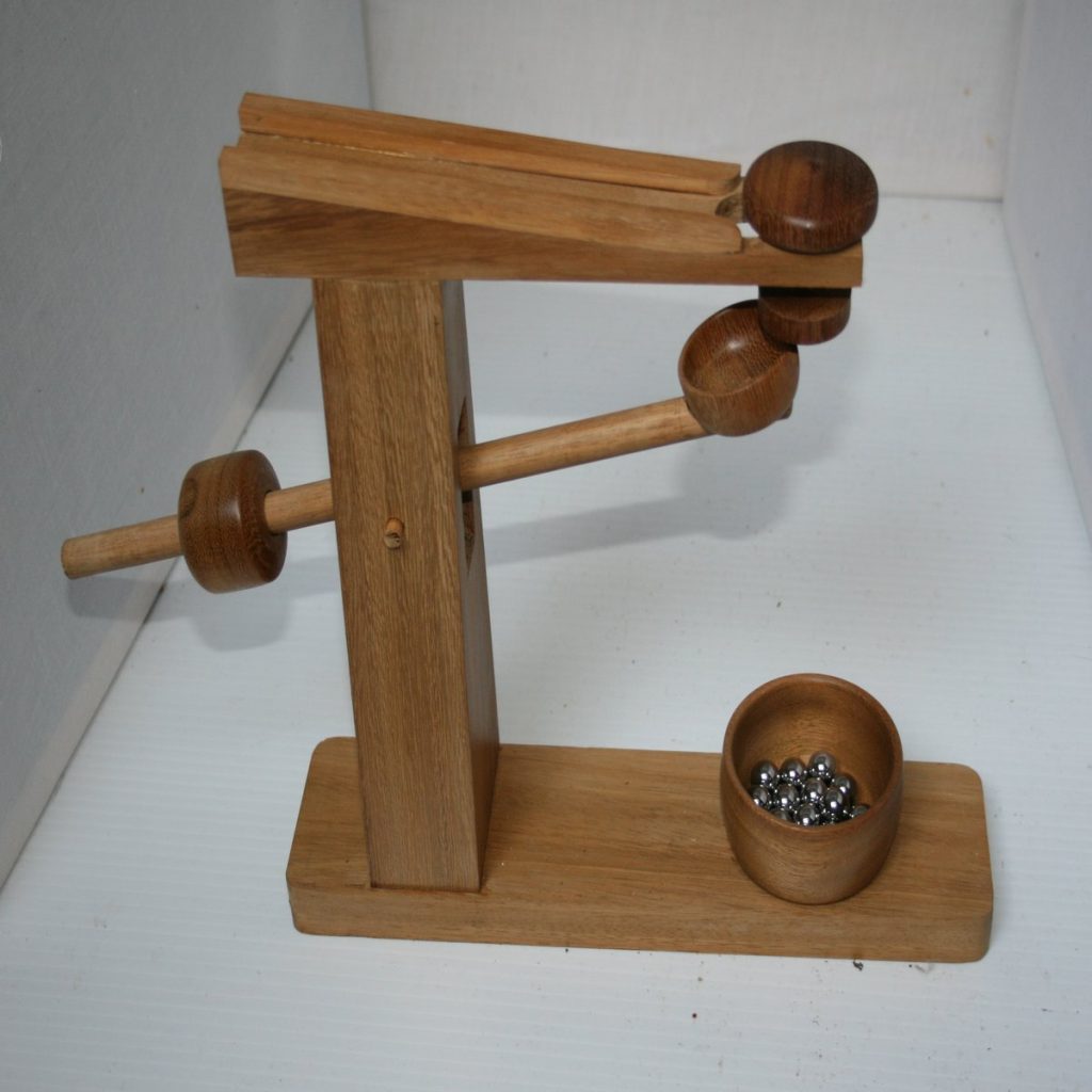 Marble game in teak wood using recycled teak and chromel ball bearings