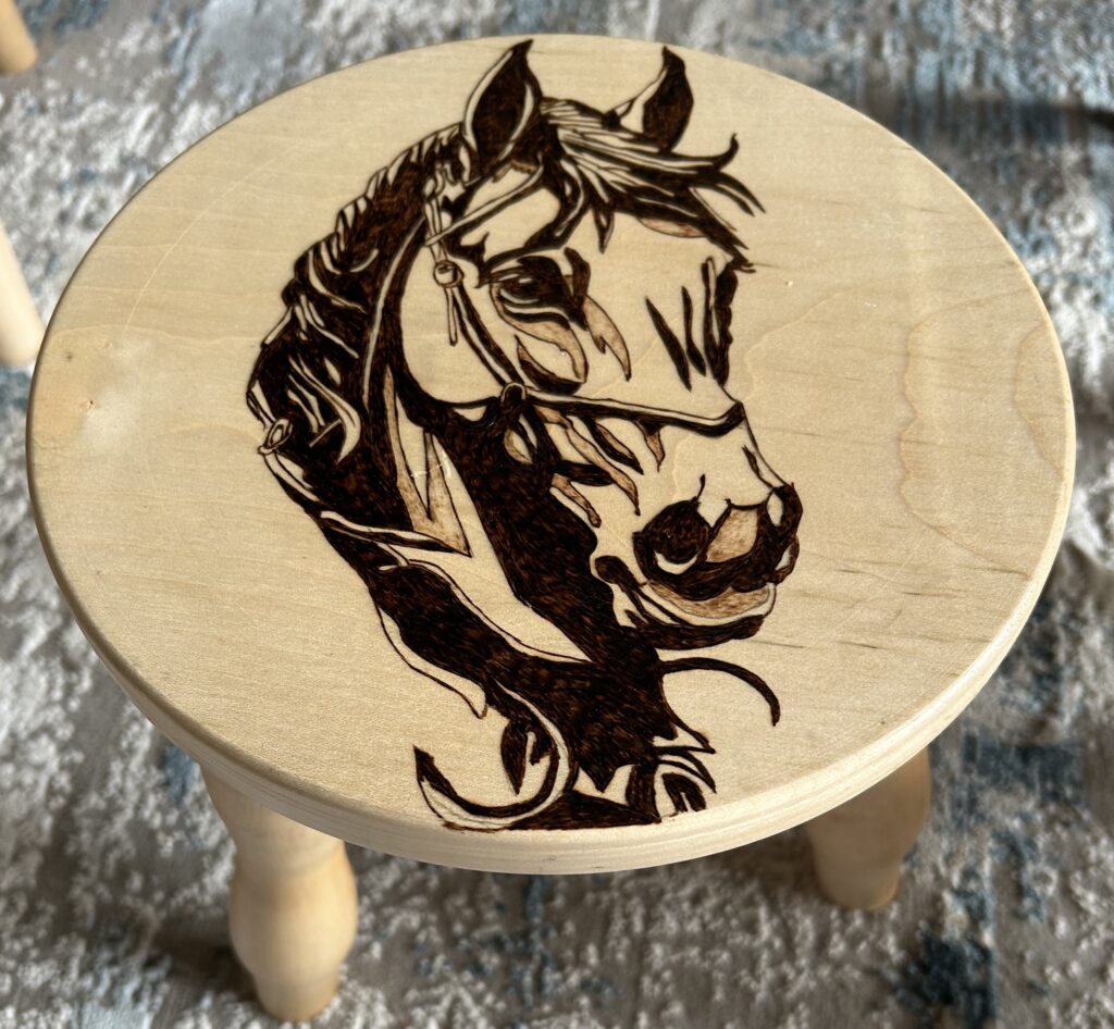 Pyrography-hand-drawn-horse-on-3-legged-stool